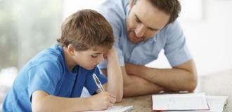 A photo of a parent helping their child with homework.