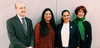 Chris, Hetal, Rachel Boyle (external speaker) and Esther smile for a picture in Walker House foyer 