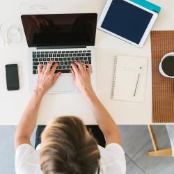 a view from above of a woman working from home 