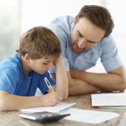 A photo of a parent helping their child with homework.