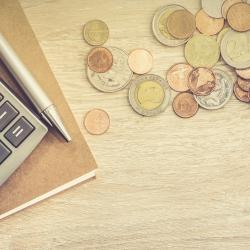 A calculator and coins