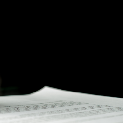 a male hand signing a legal document