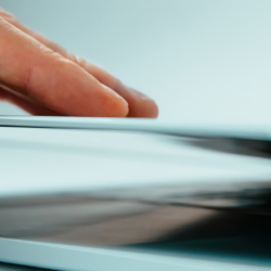 close up of a hand closing a laptop