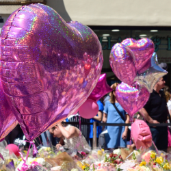 heart balloons and flowers at manchester arena attack memorial